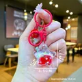 Star-shaped liquid glitter keychain in bright red with sand bottle pendant and small bell - Mini Style / Lobster Clasp / Red