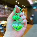Detail of neon green heart liquid keychain with drifting glitter and matching bell charm - Mini Sparkling Heart / Mini Style / Lobster Clasp / Green