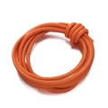 Macro shot of 4mm bright orange braided PU leather cord with detailed stitching for DIY bags - Orange