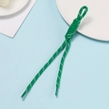 Close-up of green woven nylon zipper pull with white dots and durable sealed ends - Dark Green With White Dots