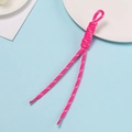 Detailed view of pink woven polyester lanyard with ring clasp on blue background - Rose Red With White Dots