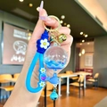 Porte-clés patte de chat lumineux avec bouteille de paillettes bleues et charme baleine - Sangle Fraise Bleu Perle de Bulle Lumineuse Cloche