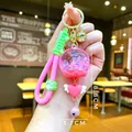 Porte-clés lumineux rose avec sable mouvant liquide et bracelet en silicone - Corde Griffe (Rose) Carillon à Bulles Lumineux
