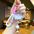 Porte-clés lumineux avec patte de chat rose, pendentif cygne et boule de sable argentée - Corde Griffe (Blanc) Carillon à Bulles Lumineux