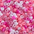 Macro view of assorted pastel acrylic pony beads in pink and white for DIY crafts - Mixed Pink