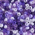 Macro detail of mixed purple and white acrylic pony beads with large holes for DIY crafts - Mixed Purple