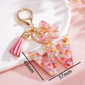 Dettaglio portachiavi lettera W in resina con paillettes rosa e dimensioni 57x43mm - Rosa W