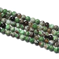 Macro detail of polished 10mm round agate stone beads with natural green and brown textures - 1 Strand Approx 60 Pcs (6-6.5mm) / Green Brown Flame Agate
