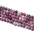 Macro detail of multi-color striped agate beads for DIY jewelry with polished finish - Rose Red Brown Flame Agate