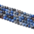 Detailed close-up of blue banded agate round beads showing natural striped patterns - Royal Blue Brown Flame Agate