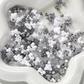 Macro shot of mixed acrylic DIY beads in grey and silver on a white ceramic tray - 20g per Pack / Gray
