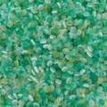 Macro view of 2x4mm green glass cat-eye beads with silk texture for DIY jewelry making - 100 Pieces/Pack (2.5x4mm) / Lake Green Yellow