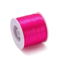 Detailed view of neon pink elastic crystal string wrapped on a white spool for DIY jewelry - Approx. 0.8mm Thickness / 400m Length / Rose Red