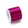 Close-up of 0.8mm rose red elastic TPU beading thread on white spool for DIY jewelry - Approx. 0.8mm Thickness / 400m Length / Purplish Red