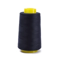 Detailed view of dark navy 402 polyester sewing thread on yellow plastic cone core - Approx 100g / Dark Blue