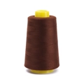 Macro detail of dark brown polyester sewing thread wound on a bright yellow plastic core - Approx 100g / Coffee