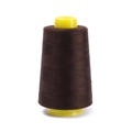 Macro shot of dark brown polyester sewing thread on yellow cone for sewing machines - Approx 100g / Dark Brown