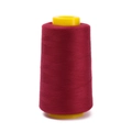 Close-up of dark red polyester sewing thread on yellow plastic cone for garment making - Approx 100g / Dark Red