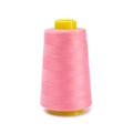 Macro detail of high-speed polyester sewing thread roll in bright pink on yellow cone - Approx 100g / Pink