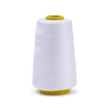Detail of high-strength white polyester sewing thread on yellow plastic spool for machines - Approx 100g / Bleached White