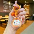 Détail d'un porte-clés renard mignon en résine avec paillettes et grelot assorti - Style Mousqueton / Orange Perle de Bulle Noctilucente Renard