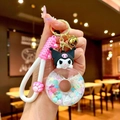 Détail du porte-clés Kuromi avec boule de donut liquide et sangle en silicone rose - Corde À Griffes [kuromi] Donut En Pvc Phosphorescent