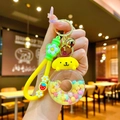 Détail du porte-clés Pompompurin donut avec anneau scintillant et dragonne jaune - Corde À Fraises [buding Dog] Donut Phosphorescent En Forme De C