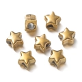 Macro shot of gold star-shaped stainless steel spacer beads with holes for DIY jewelry - 5 Pieces / Gold Star 1