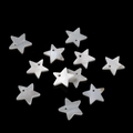 Macro view of natural white shell star beads with pre-drilled holes for DIY jewelry - Large Pentagram
