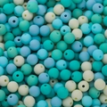 Macro shot of 6mm matte pastel acrylic round beads with holes for DIY craft jewelry making - Lake Blue Series
