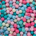 Macro shot of 6mm matte colorful acrylic beads with holes for DIY jewelry making - Blue And Pink