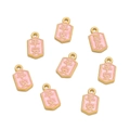 Detailed macro view of pink enamel charms with golden Peace and Joy Chinese characters - 1pc/pack / Peace Joy Pink