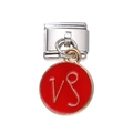 Macro detail of Capricorn zodiac charm on silver stainless steel link bracelet component - Red Capricorn
