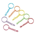 Close-up of assorted colorful painted metal lobster clasp keychains on white background - Model AC4325 / Mixed Random