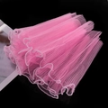 Detail of pink wavy tulle mesh with white pearl edge trim for floral and DIY gift wrapping - Peach Pink Pearl Edge