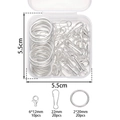 Macro detail of DIY keychain hardware kit including lobster clasps and jump rings in a box - Silver