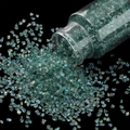 Macro shot of 30g iridescent green glass glitter for nail art and DIY crafts in a jar - Teal / 30ml Bottle