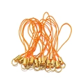 Detail of orange braided phone cords with golden metal clasps for DIY jewelry making - Gold Orange Rhinestone