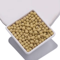Creamy beige porous lava rock beads for DIY essential oil jewelry in white tray - Yellow