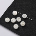 Macro detail of natural shell bead with golden letter C inlay for DIY jewelry making - 2 Pieces (8.5x4.5mm) / Letter C (Pearl White)