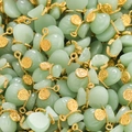 Close-up of bulk money bag pendants with small gold coins for DIY jewelry making - Green Style 03 (2 Pieces/Pack)