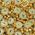 Macro shot of green jade-like Ruyi lock pendants with gold filigree and bells - Green Style 04 (2 Pieces/Pack)
