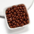 Detail of 8mm brown acrylic beads for DIY jewelry making displayed in a white dish - 50 Pieces/Pack (4.5x8mm) / Coffee
