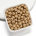 Macro shot of milk-tea colored acrylic flat round spacer beads in a white ceramic bowl - 50 Pieces/Pack (4.5x8mm) / Khaki