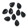 Macro view of eight faceted black pear-shaped glass rhinestones for DIY sewing - 10 Pieces Pack / Black (21 Style)