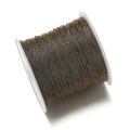 Detalle de cordón metálico de bronce en carrete blanco para hacer joyas de bricolaje - Marrón