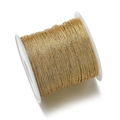 Primer plano de carrete de hilo dorado metálico para tejido de joyas y bordado manual - Amarillo Tierra