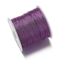 Primer plano de cordón trenzado de poliéster morado en carrete para hacer joyas - Púrpura