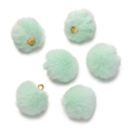Detailed view of soft mint green pom-pom pendants with gold metal rings for DIY jewelry - Light Green