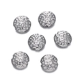 Detailed macro view of six silver stainless steel floral beads with textured finish - Vintage Embossed Disc Style (Steel Color 07)